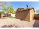 Exterior shot of backyard featuring artificial turf, gravel, and exterior of home at 34710 N 27Th Ave, Phoenix, AZ 85086