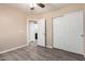 This bedroom includes a ceiling fan, closet with sliding doors, and access to an ensuite bathroom at 34710 N 27Th Ave, Phoenix, AZ 85086