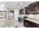 Well-equipped kitchen boasting granite countertops, a stainless-steel range, and sleek cabinetry at 34710 N 27Th Ave, Phoenix, AZ 85086