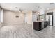 Open concept kitchen featuring wood floors, granite counters, stainless appliances and a large center island at 34710 N 27Th Ave, Phoenix, AZ 85086