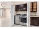 This laundry room features modern washer and dryer, cabinets and tile flooring at 34710 N 27Th Ave, Phoenix, AZ 85086