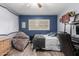 Bedroom with plank flooring, modern window shutters, and desk workspace at 3526 N 85Th St, Scottsdale, AZ 85251