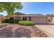 Traditional home showcasing desert landscaping, concrete driveway, and attached two-car garage at 3526 N 85Th St, Scottsdale, AZ 85251