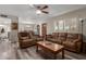 Open-concept living room showcasing plank flooring, wood door, and plantation shutters at 3526 N 85Th St, Scottsdale, AZ 85251