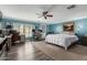 Large main bedroom features plank flooring, ceiling fan, and bright window at 3526 N 85Th St, Scottsdale, AZ 85251