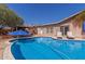 Relaxing pool area with lounge chairs and shade; an idyllic outdoor retreat at 3526 N 85Th St, Scottsdale, AZ 85251