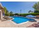 Sparkling pool is surrounded by lush greenery and lounge chairs, perfect for outdoor relaxation at 3526 N 85Th St, Scottsdale, AZ 85251