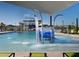 Community splash pad area featuring water features, lounge chairs, sun shades and well-maintained grounds at 37049 N Lokai Dr, San Tan Valley, AZ 85140