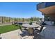 Backyard patio with comfortable seating and a lush, green lawn perfect for entertaining outdoors at 37200 N Cave Creek Rd # 1013, Scottsdale, AZ 85262