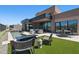 Lush backyard features a pool, outdoor seating, a fire pit, and a well-manicured lawn at 37200 N Cave Creek Rd # 1013, Scottsdale, AZ 85262