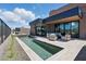 Beautiful backyard with a sleek pool, lounge area, and a seamlessly integrated desert landscape at 37200 N Cave Creek Rd # 1013, Scottsdale, AZ 85262