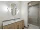 Bathroom features a modern vanity, stylish mirror, and glass shower at 37200 N Cave Creek Rd # 1013, Scottsdale, AZ 85262