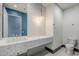 Modern bathroom with patterned backsplash, floating vanity and hexagon tile floor at 37200 N Cave Creek Rd # 1013, Scottsdale, AZ 85262