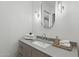 Well-lit bathroom features a modern sink, decorative mirror, and elegant fixtures at 37200 N Cave Creek Rd # 1013, Scottsdale, AZ 85262