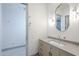 Well-lit bathroom featuring a modern vanity with drawers, a stylish mirror, and chrome sconce lighting at 37200 N Cave Creek Rd # 1013, Scottsdale, AZ 85262