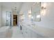Bright, spacious bathroom with double vanity, tub and glass shower at 37200 N Cave Creek Rd # 1013, Scottsdale, AZ 85262