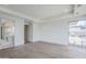 Bedroom with hardwood flooring leads to bathroom and features a large window at 37200 N Cave Creek Rd # 1013, Scottsdale, AZ 85262