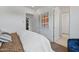 Clean bedroom with an attached closet, hard wood flooring, and modern design at 37200 N Cave Creek Rd # 1013, Scottsdale, AZ 85262