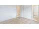 Bright bedroom featuring hardwood floors, white walls and trim, closet with double doors, and a neutral color scheme at 37200 N Cave Creek Rd # 1013, Scottsdale, AZ 85262