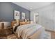 Serene bedroom with plush bedding, accent wall, and minimalist decor at 37200 N Cave Creek Rd # 1013, Scottsdale, AZ 85262