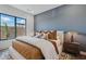 Comfortable bedroom features plush bedding, contemporary design, and large windows for natural light at 37200 N Cave Creek Rd # 1013, Scottsdale, AZ 85262