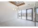 Bright dining room featuring backyard and mountain views, statement ceiling and modern lighting at 37200 N Cave Creek Rd # 1013, Scottsdale, AZ 85262