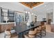 Open dining space featuring modern lighting, a wine rack, and kitchen access, perfect for entertaining at 37200 N Cave Creek Rd # 1013, Scottsdale, AZ 85262