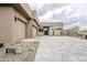 An eye-catching house with desert landscaping and spacious stone driveway at 37200 N Cave Creek Rd # 1013, Scottsdale, AZ 85262