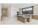 Modern kitchen featuring a large island with a dark countertop and custom cabinetry at 37200 N Cave Creek Rd # 1013, Scottsdale, AZ 85262