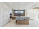 Bright, open kitchen featuring a large island and stainless steel appliances at 37200 N Cave Creek Rd # 1013, Scottsdale, AZ 85262