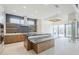 Spacious kitchen featuring an island with stone countertop, open shelving, and chef's range at 37200 N Cave Creek Rd # 1013, Scottsdale, AZ 85262