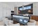 Contemporary kitchen featuring a black marble island with seating and modern stainless steel appliances at 37200 N Cave Creek Rd # 1013, Scottsdale, AZ 85262