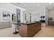 Modern kitchen features a large island with seating, sleek cabinetry, and open design to the living spaces at 37200 N Cave Creek Rd # 1013, Scottsdale, AZ 85262