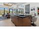 Open-concept kitchen featuring a large island, modern appliances, and seamless flow to the dining and living areas at 37200 N Cave Creek Rd # 1013, Scottsdale, AZ 85262