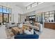 Spacious living room with soaring ceilings, expansive windows, and modern decor adjacent to the gourmet kitchen at 37200 N Cave Creek Rd # 1013, Scottsdale, AZ 85262