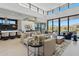 Bright, open living space with high ceilings, floor-to-ceiling windows, and views to outdoor spaces at 37200 N Cave Creek Rd # 1013, Scottsdale, AZ 85262