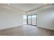 Bright, open living room with wood floors and sliding glass doors at 37200 N Cave Creek Rd # 1013, Scottsdale, AZ 85262