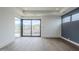 Open living room features hardwood floors, large windows, and backyard patio access at 37200 N Cave Creek Rd # 1013, Scottsdale, AZ 85262