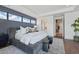 Primary bedroom features generous natural light and minimalist furniture at 37200 N Cave Creek Rd # 1013, Scottsdale, AZ 85262