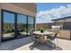 Charming outdoor dining space featuring built-in grill, dining table, desert views and tile floor at 37200 N Cave Creek Rd # 1013, Scottsdale, AZ 85262
