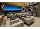 Stylish outdoor lounge with comfortable seating, fireplace, bar, and panoramic sunset views at 37200 N Cave Creek Rd # 1013, Scottsdale, AZ 85262