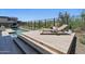 Inviting poolside lounge area with stylish chaise lounge, set near a clear, modern pool with desert views at 37200 N Cave Creek Rd # 1013, Scottsdale, AZ 85262