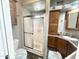 Bright bathroom featuring a glass shower and light wood cabinets at 381 S Gypsum Dr, Apache Junction, AZ 85119