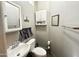 Cozy bathroom with pedestal sink and cabinet offering practical storage solutions at 381 S Gypsum Dr, Apache Junction, AZ 85119