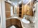 Bathroom features wood cabinets, dual sinks, and plenty of storage at 381 S Gypsum Dr, Apache Junction, AZ 85119