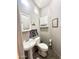 Cozy bathroom with pedestal sink and cabinet offering practical storage solutions at 381 S Gypsum Dr, Apache Junction, AZ 85119