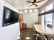 Bright dining area with a ceiling fan, large windows, and a dining set at 381 S Gypsum Dr, Apache Junction, AZ 85119