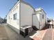 Exterior elevation of home with AC unit on a sunny day at 381 S Gypsum Dr, Apache Junction, AZ 85119