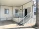 Relaxing front porch features seating area and shade from sun, and is close to the entryway at 381 S Gypsum Dr, Apache Junction, AZ 85119