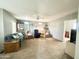 Inviting living room with a ceiling fan, plush seating, and an open layout perfect for relaxation and gatherings at 381 S Gypsum Dr, Apache Junction, AZ 85119